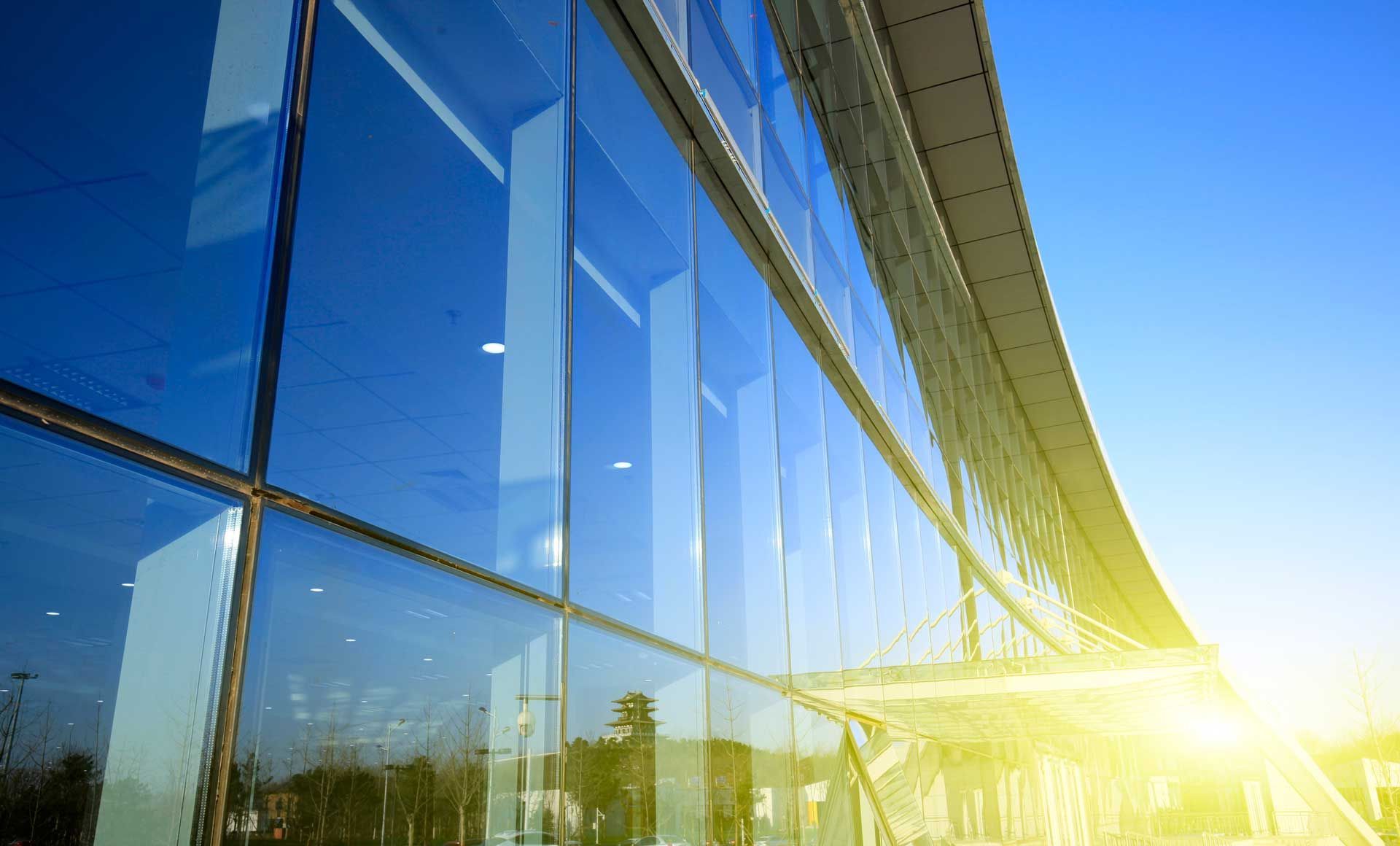 The sun is shining through the windows of a building.