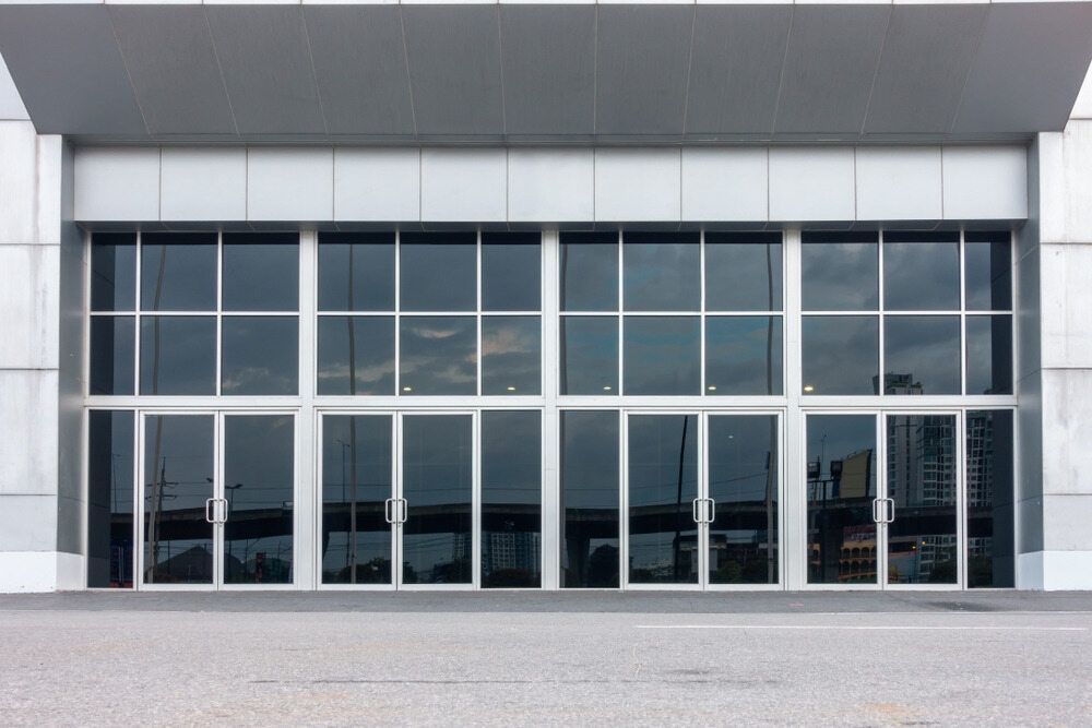 A Large Building With A Lot Of Windows And Doors — Browny's Glass & Aluminium in Wingham, NSW