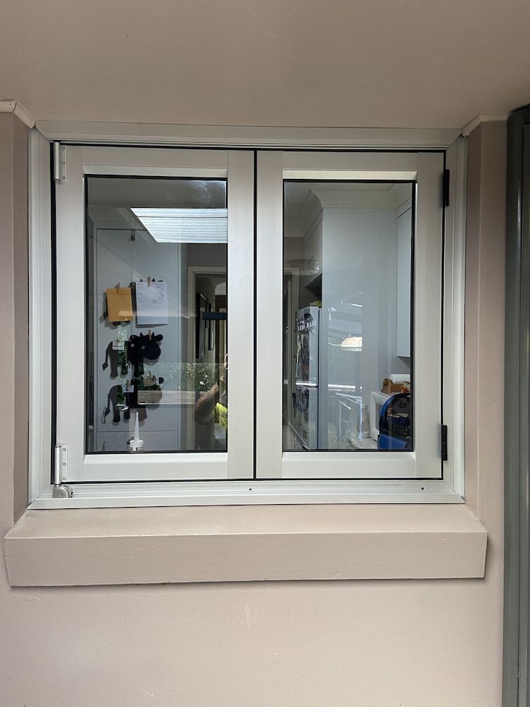 A Window In A Room With A View Of A Kitchen — Browny's Glass & Aluminium in Wingham, NSW