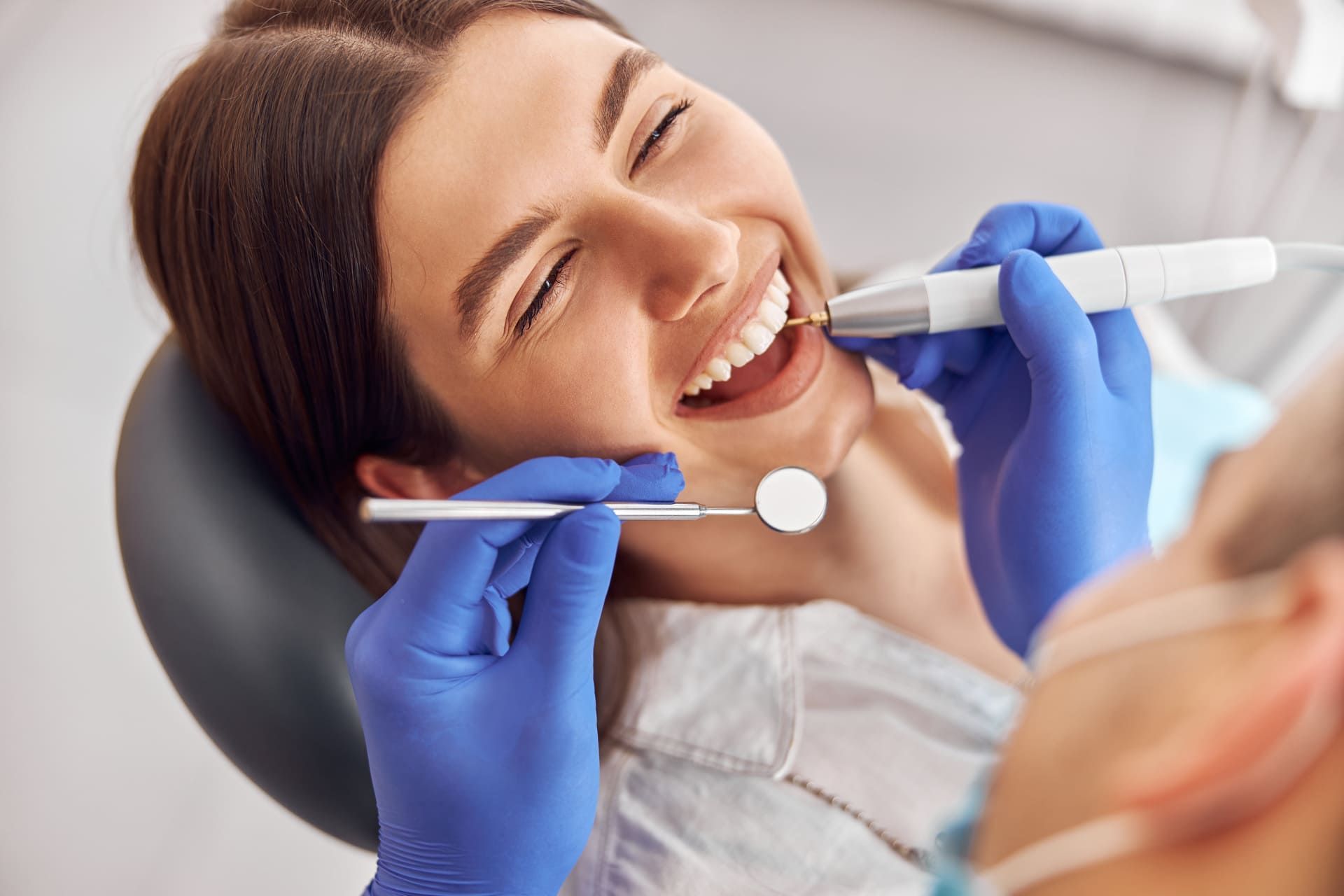 Adult Woman Receiving Dental Treatment