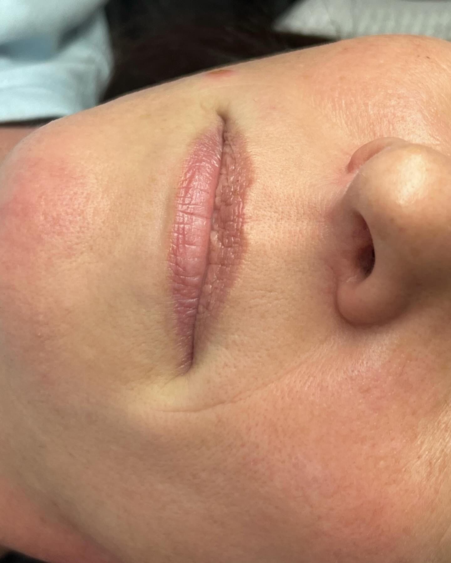 A close up of a woman 's face with her eyes closed.