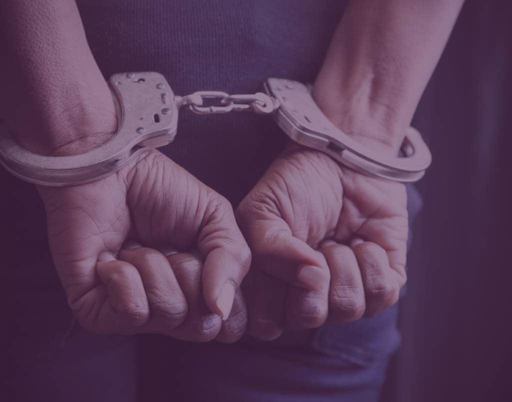 Image of Hands handcuffed.