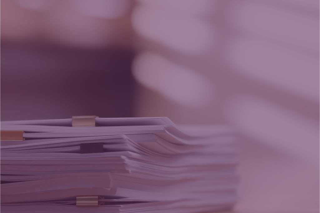 A close up of a last will and testament with a pen and glasses.