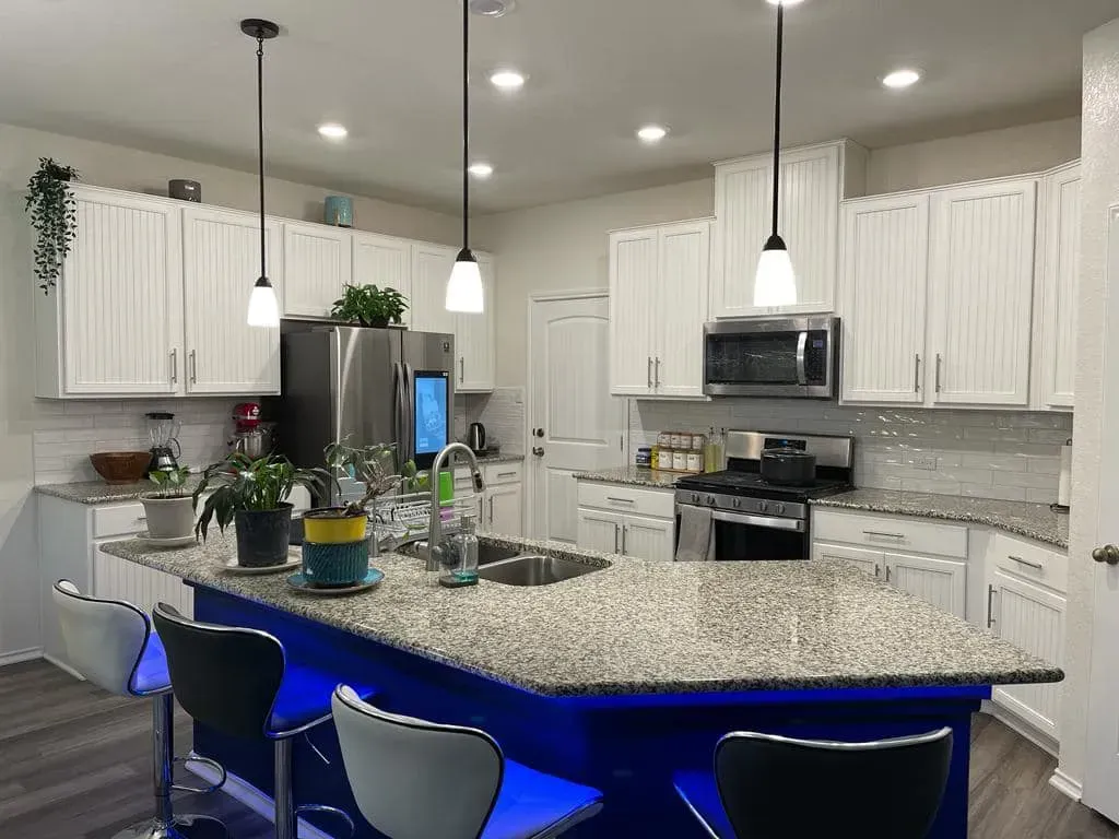 Countertops with neon lighting underneath them