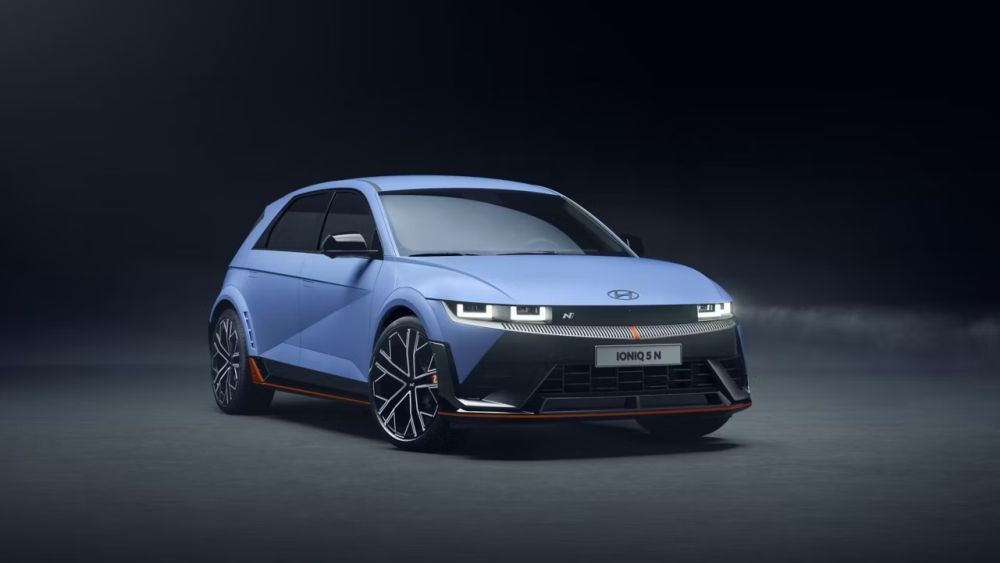 Hyundai Ioniq 5 N electric car, blue body, black accents, red trim, dark background, front view.
