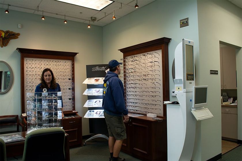 A man and a woman shopping for eyeglasses
