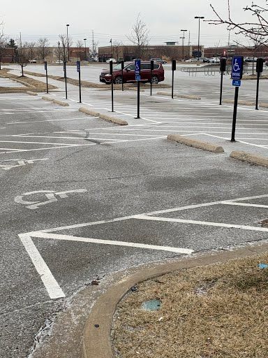 A parking lot with a handicapped parking spot in the middle