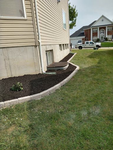 A house with a truck parked in front of it.