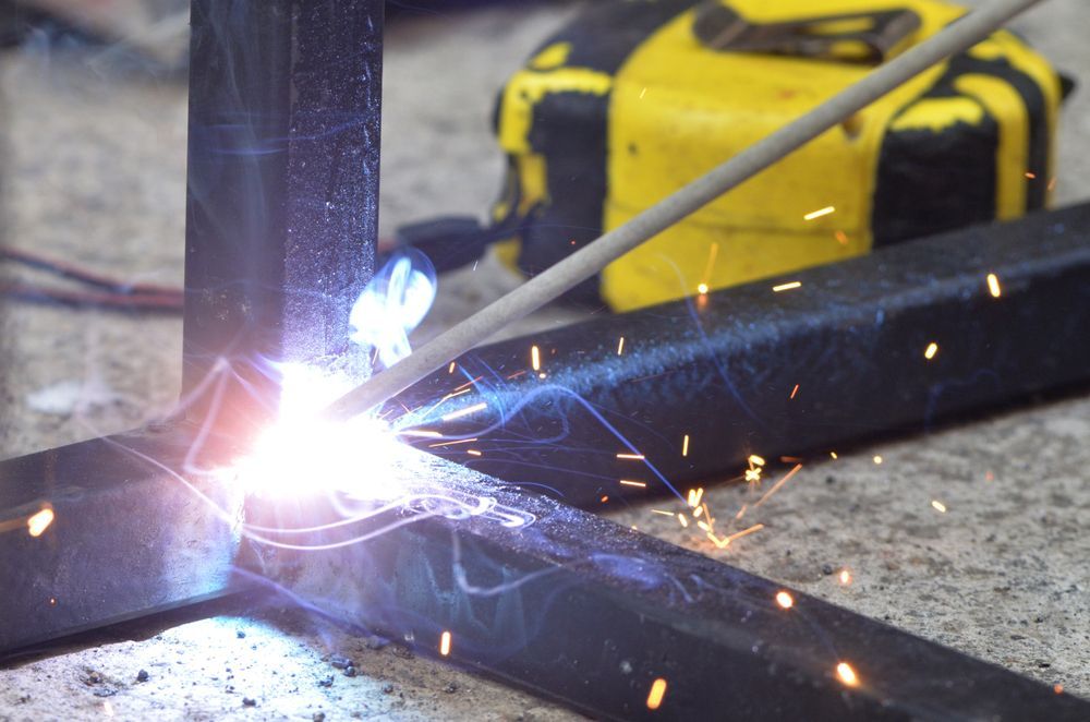 A Close Up Of A Person Welding A Piece Of Metal — Tinman's Welding Worx In Sarina, QLD