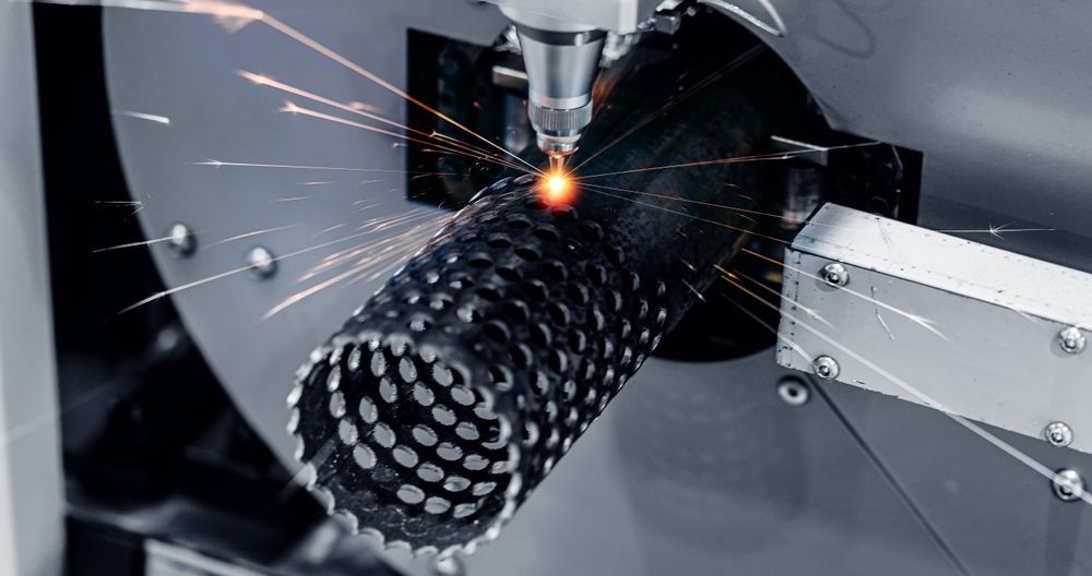 A Machine Is Cutting A Metal Pipe With Sparks Coming Out Of It — Tinman's Welding Worx In Moranbah, QLD
