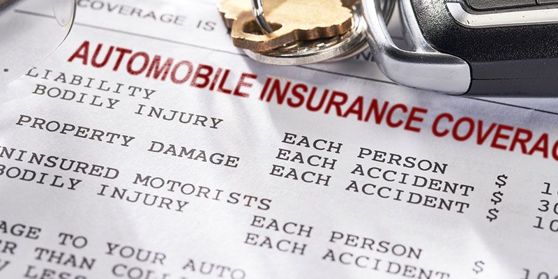 A close up of an automobile insurance coverage form