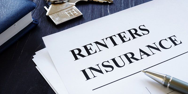 A pen is sitting on top of a piece of paper that says renters insurance.