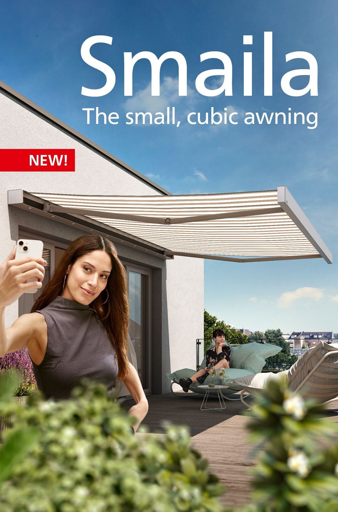 A woman is taking a selfie under an awning on a balcony.