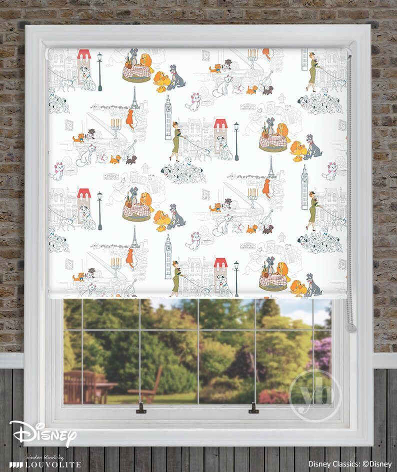 A window with a disney blind on it and a brick wall behind it.