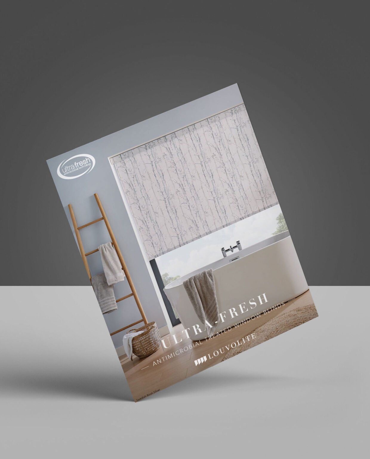 A brochure for a shower curtain is sitting on a table.