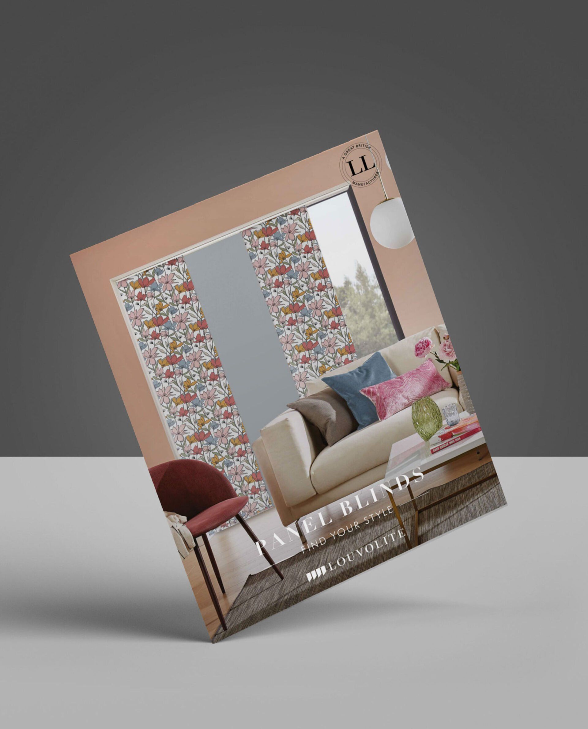 A brochure for a living room with a couch and chair on a table.
