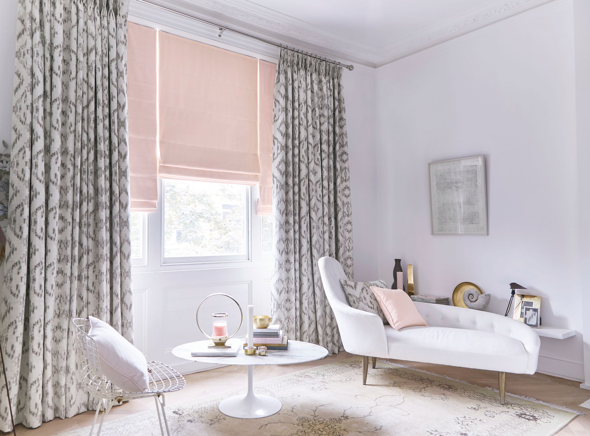 A living room with a white couch and a white table