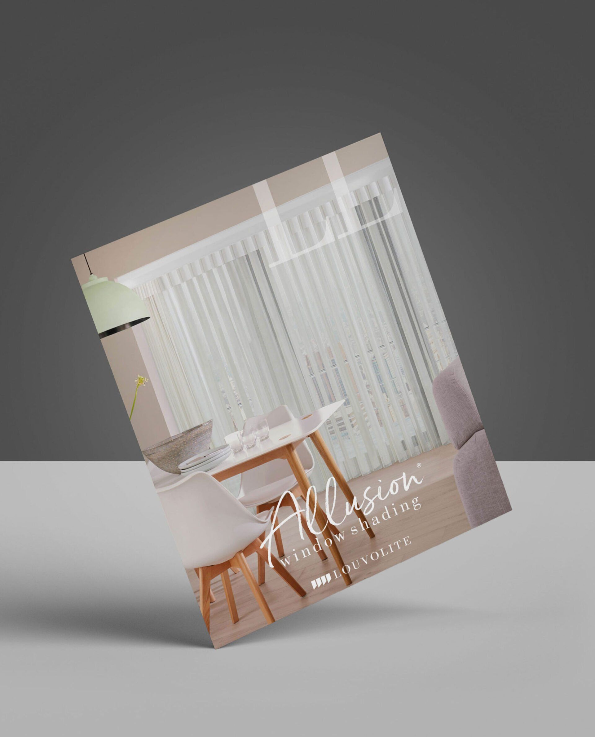 A book is sitting on a table with a picture of a living room.