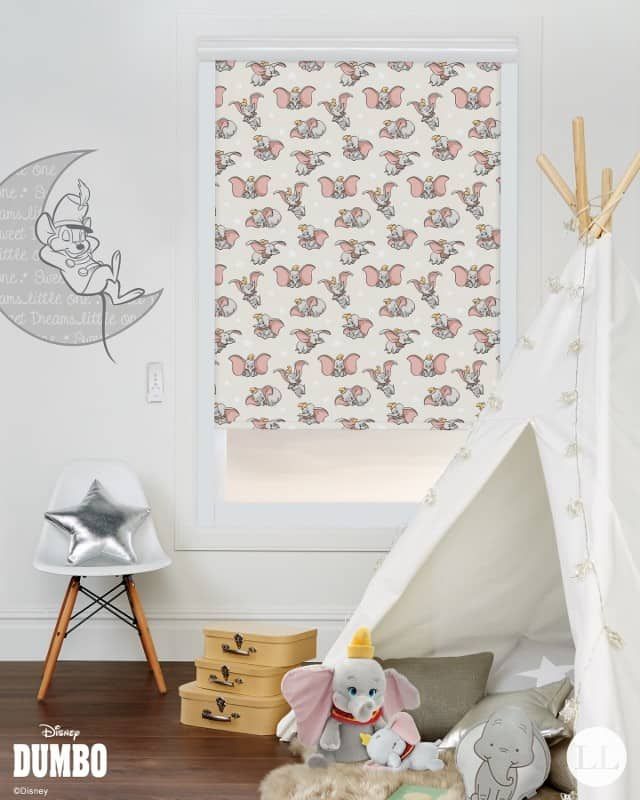 A child 's room with dumbo on the wall