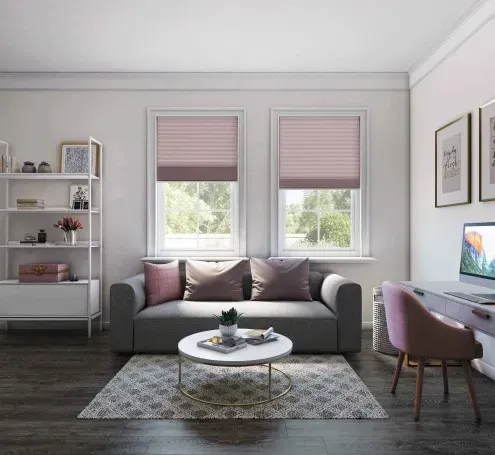 A living room with a couch and a desk