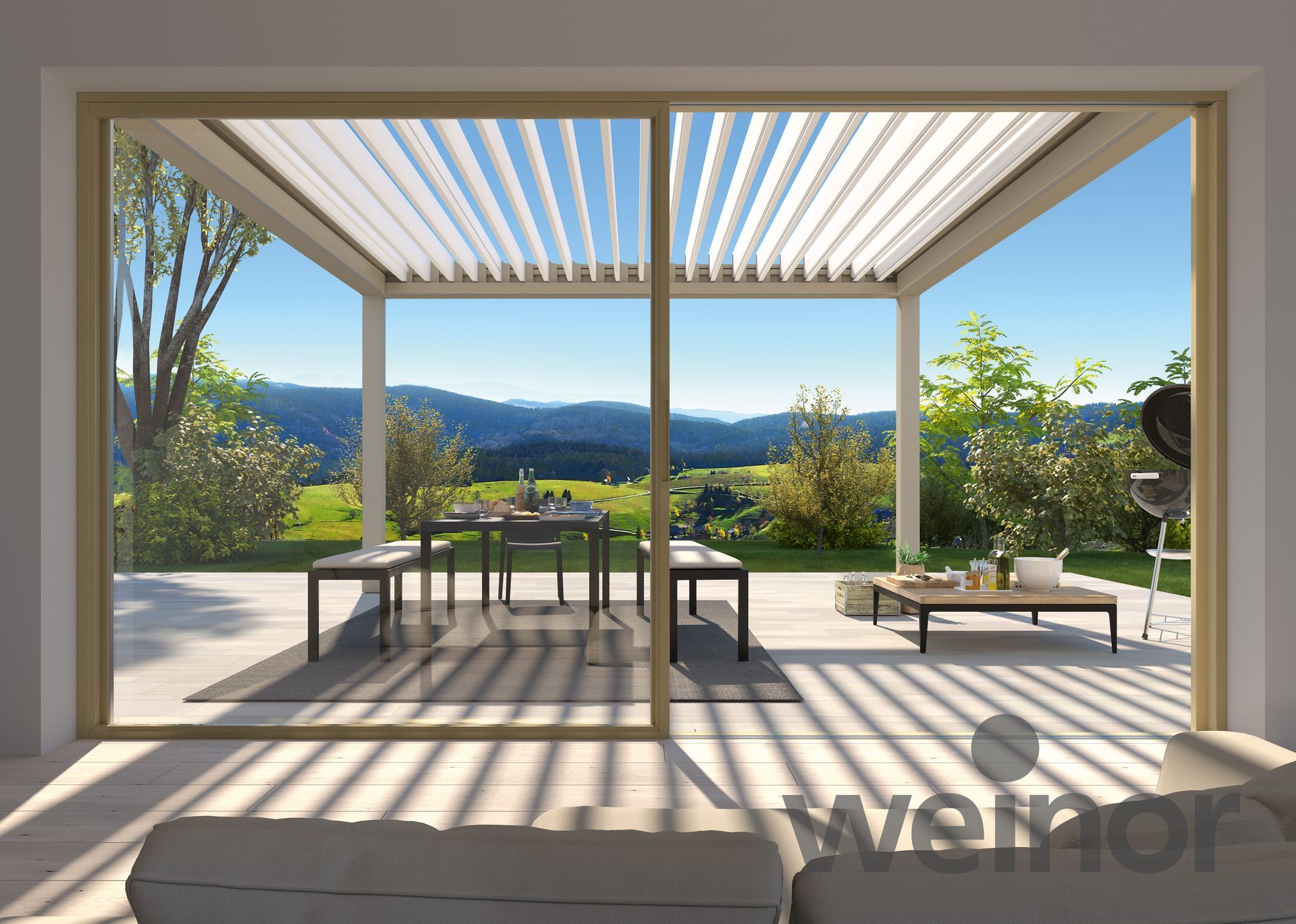A living room with a pergola overlooking a patio with a table and chairs.