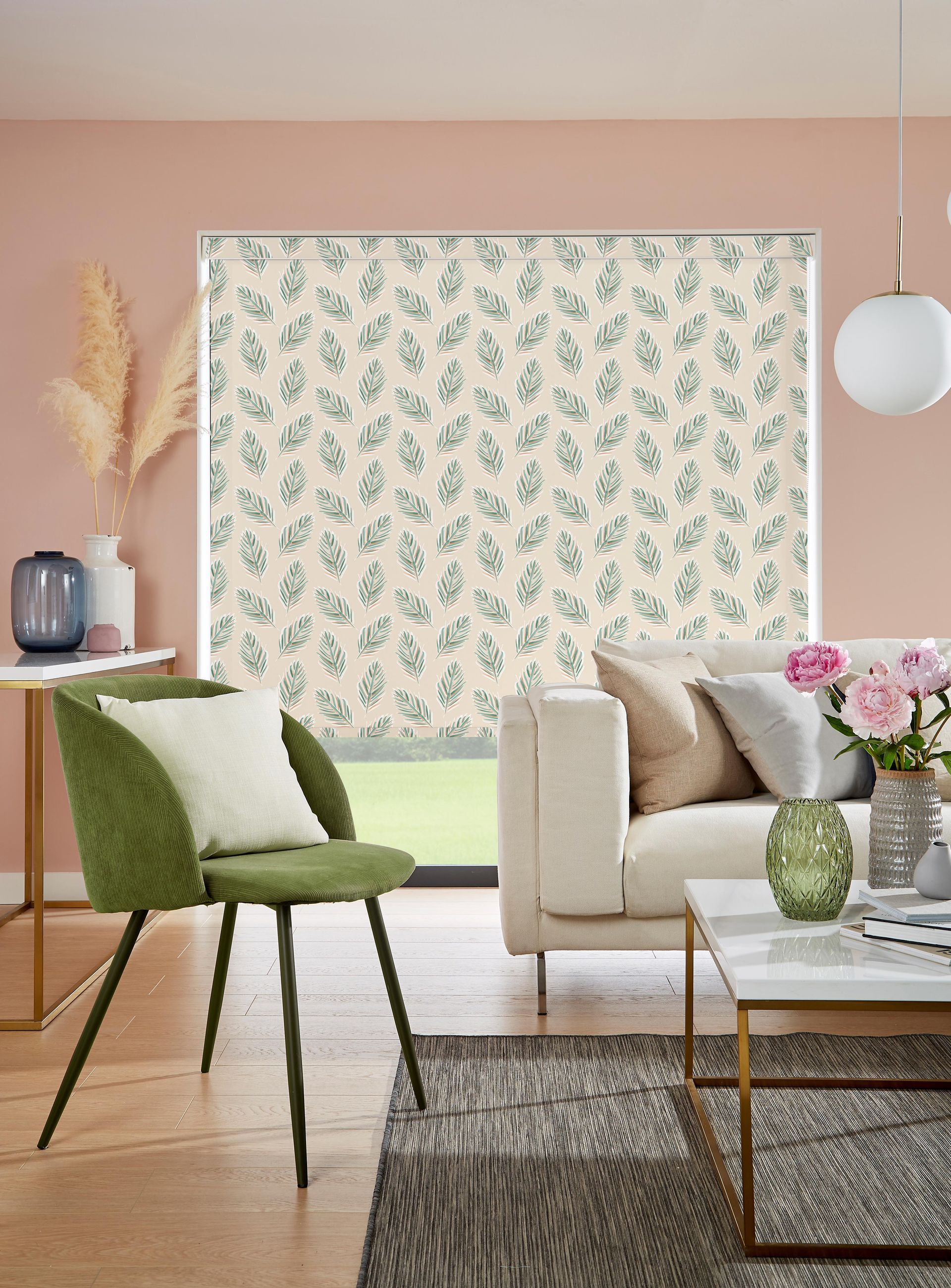 A living room with a couch , chair , coffee table and blinds.