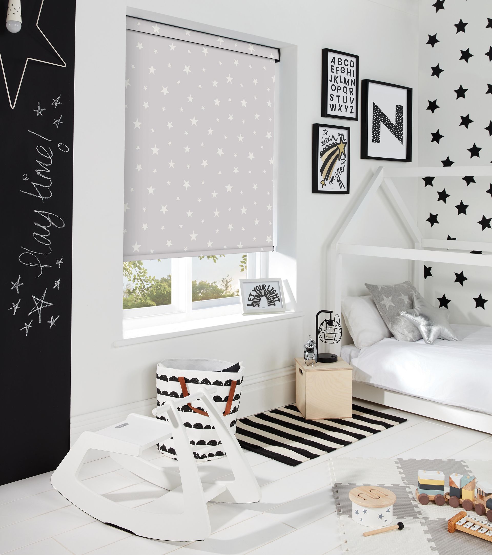 A bedroom with a bed and a rocking horse