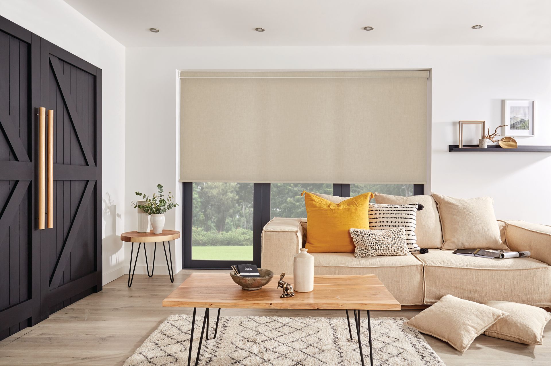 A living room with a couch , coffee table , and window.