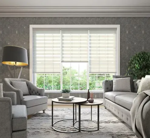 A living room with a couch , chairs , tables and a lamp.