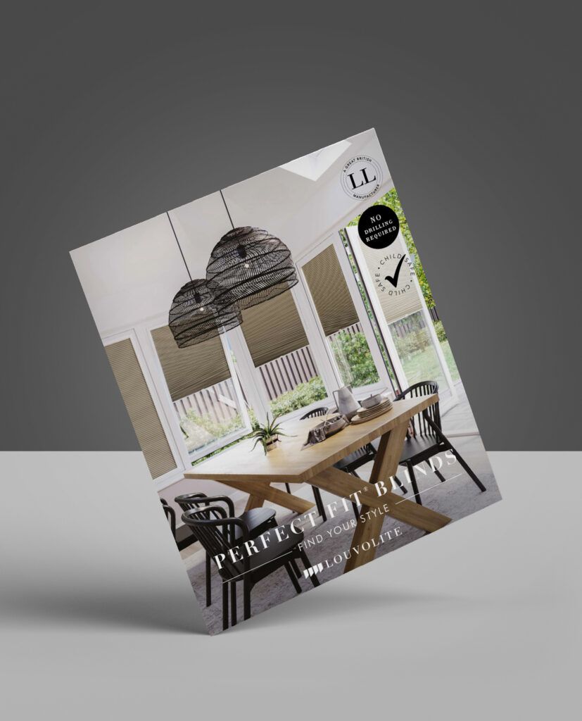 A brochure with a picture of a dining room table and chairs is sitting on a table.