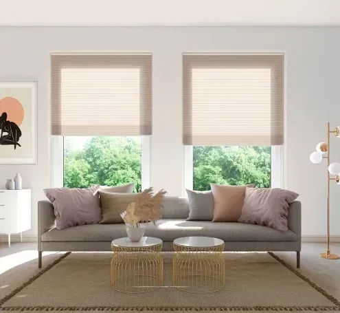 A living room with a couch , two coffee tables , and two windows.