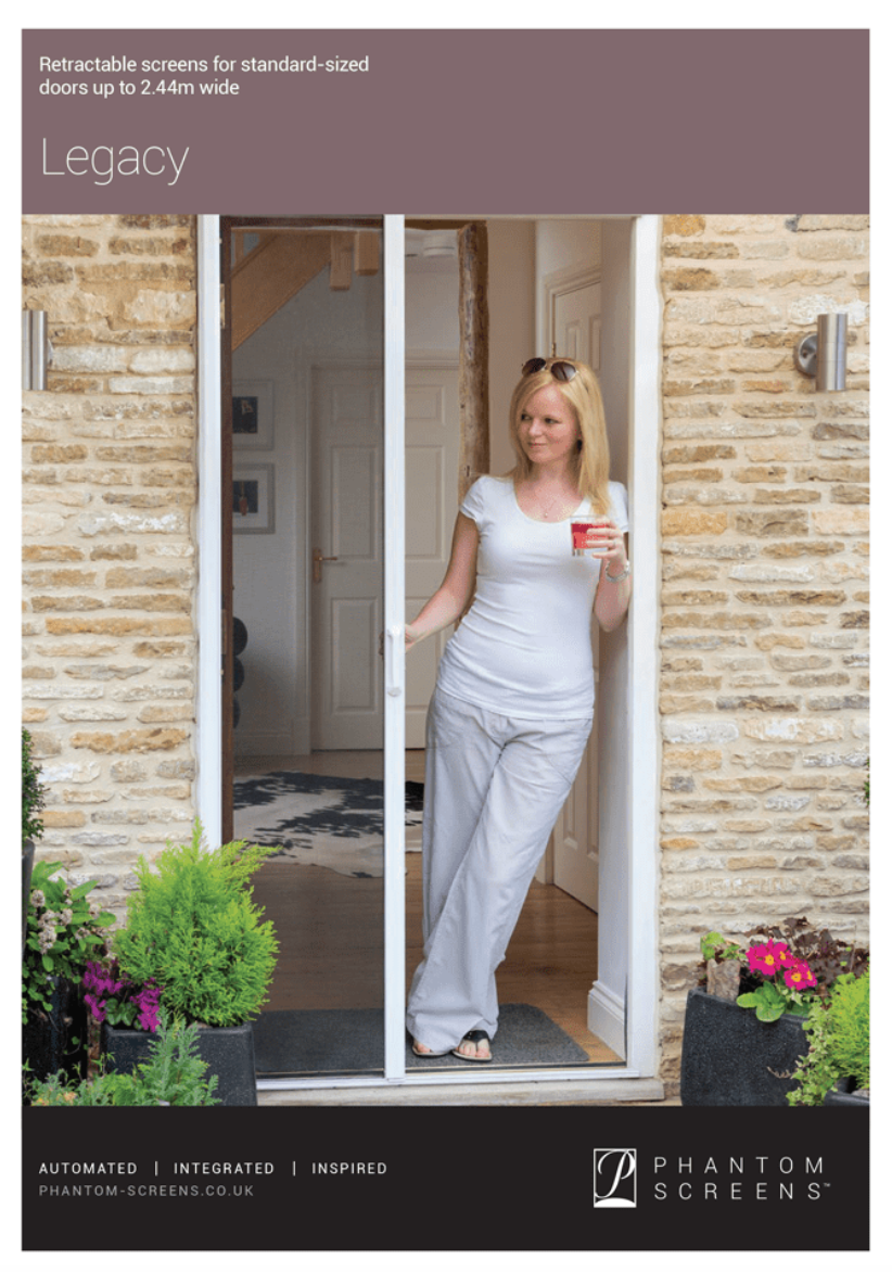 A woman is standing in front of a sliding glass door holding a cup of coffee.
