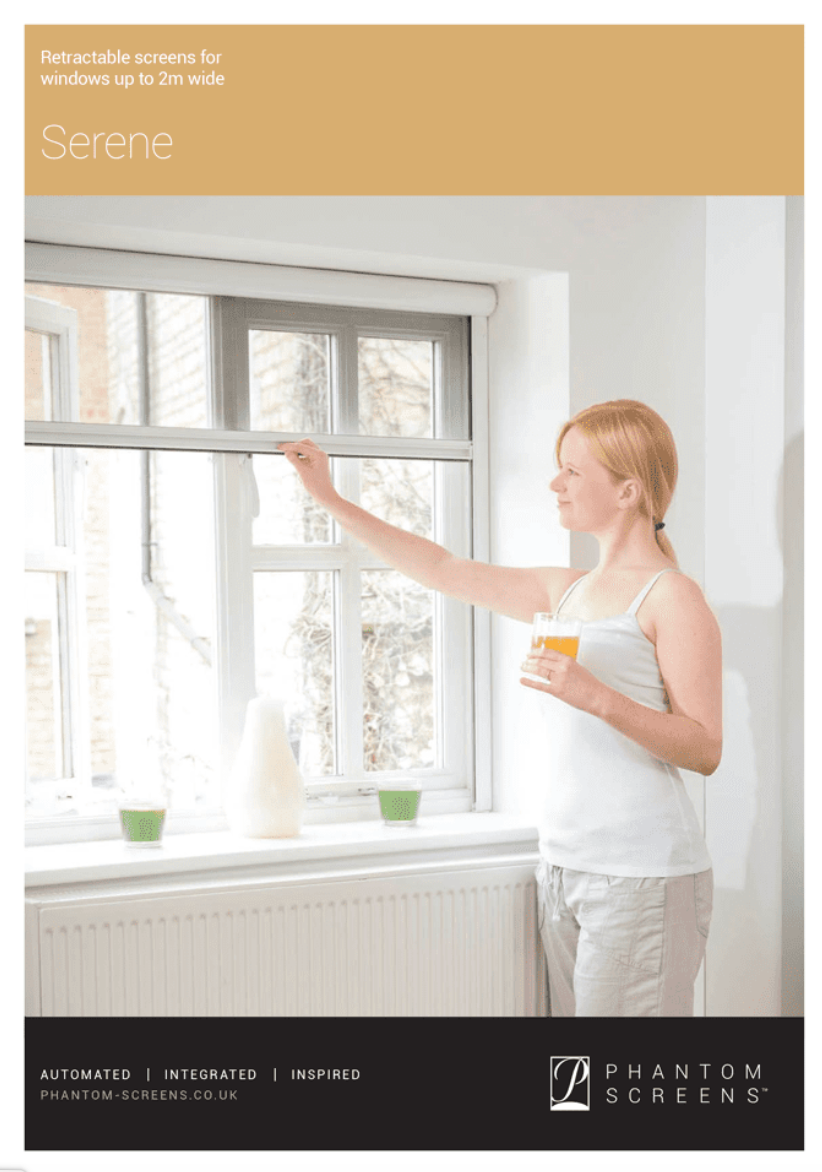 A woman is standing in front of a window holding a cup of coffee.