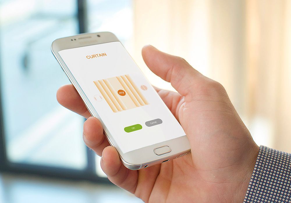 A person is holding a cell phone in their hand.