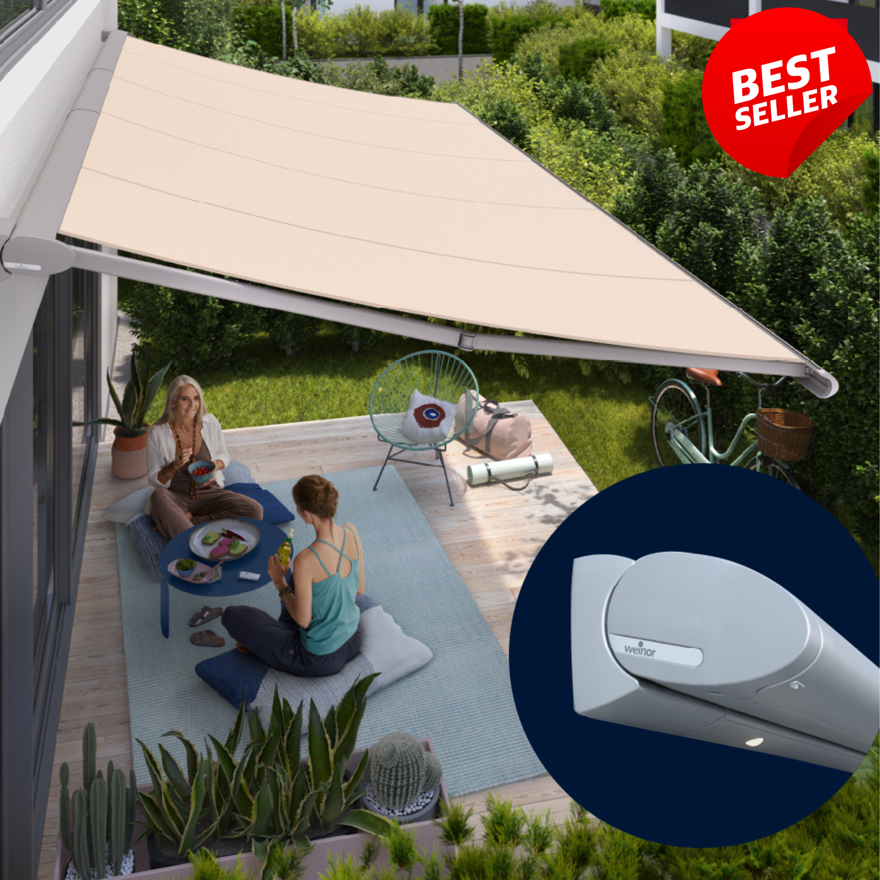 Two women are sitting on a patio under an awning.