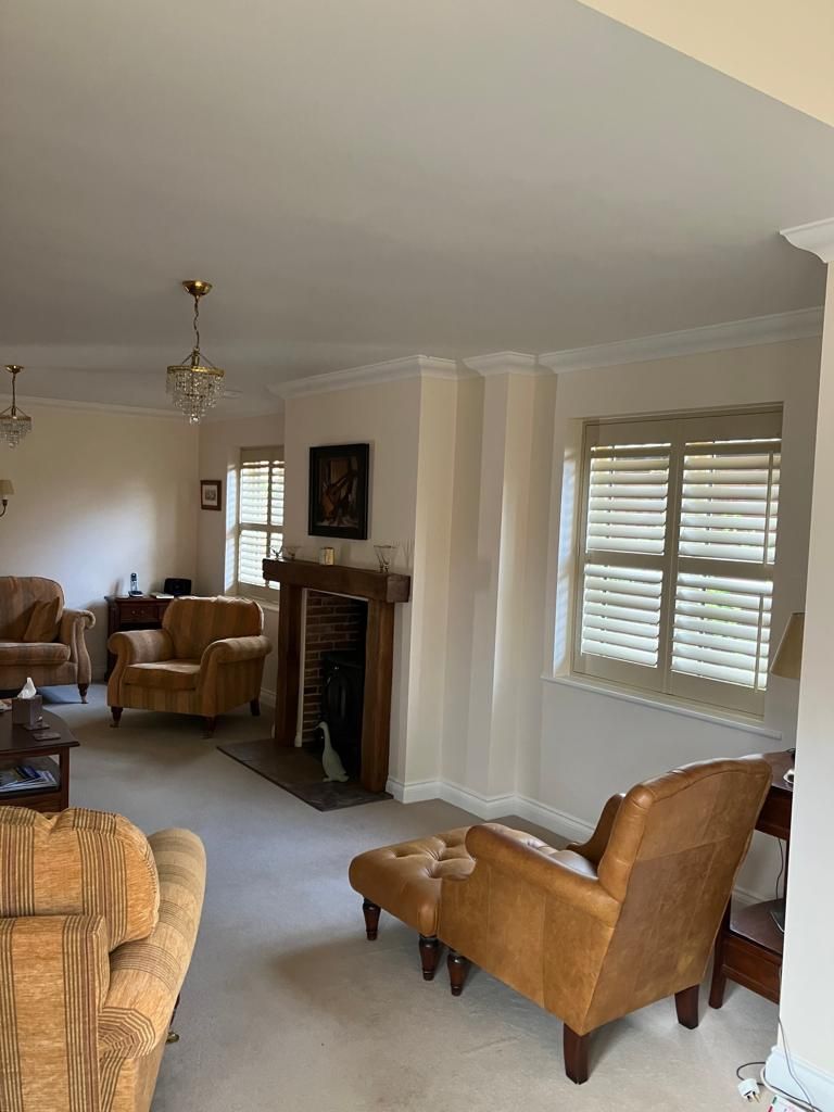 A living room filled with furniture and a fireplace.