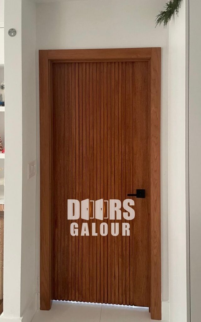 Two white doors in a hallway; one closed, one slightly ajar.