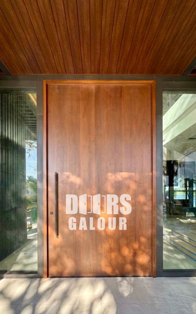 Black modern front door with horizontal silver accent and long vertical handle.