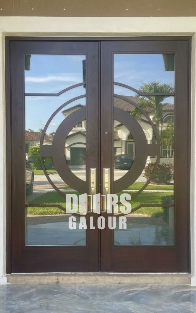 Gray double Fiberglass doors on a house with a tiled entrance and a mailbox.