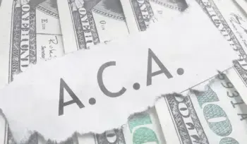 A pile of money with a piece of paper that says a.c.a. on top of it.