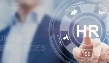 A man is pressing a button on a screen that says hr.