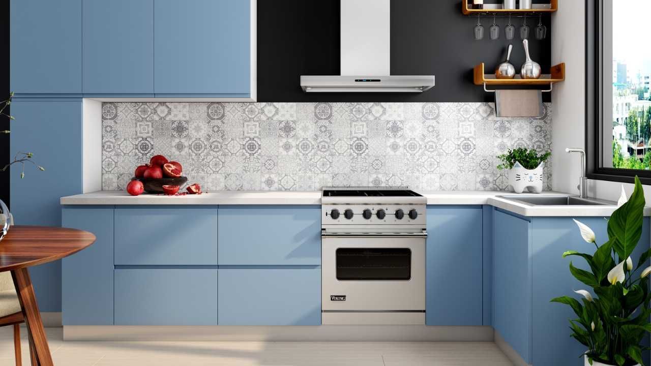 A kitchen with blue cabinets.