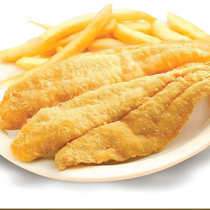 Golden fried fish fillets with French fries on a white plate