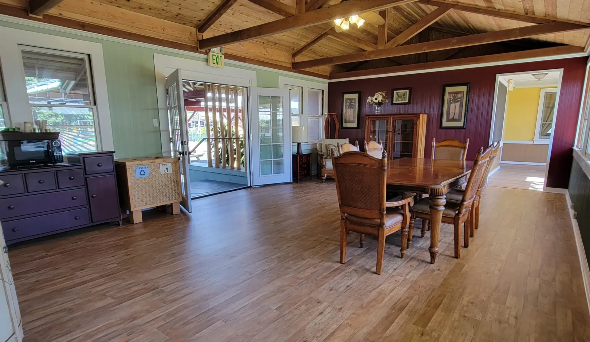 A large room with a table and chairs in it.