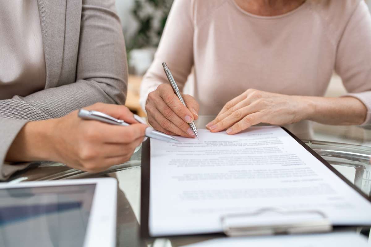 Funeral director helping a family review funeral paperwork in Lemon Grove, California.