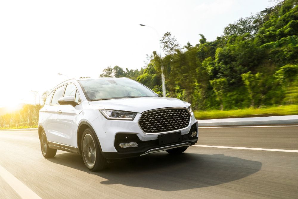 White SUV Speeding Fast On The Road — Gympie Car Transport in Gympie, QLD