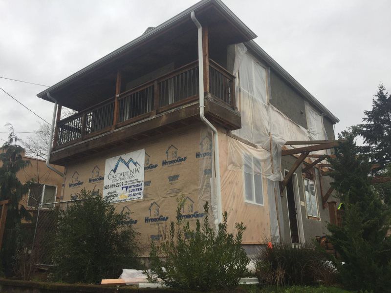 A house with a balcony is being remodeled.