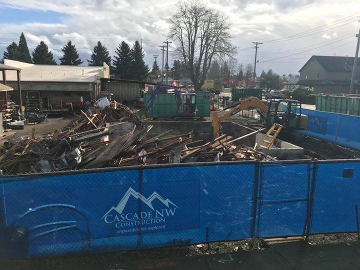 A building is being demolished by cascade northwest construction.