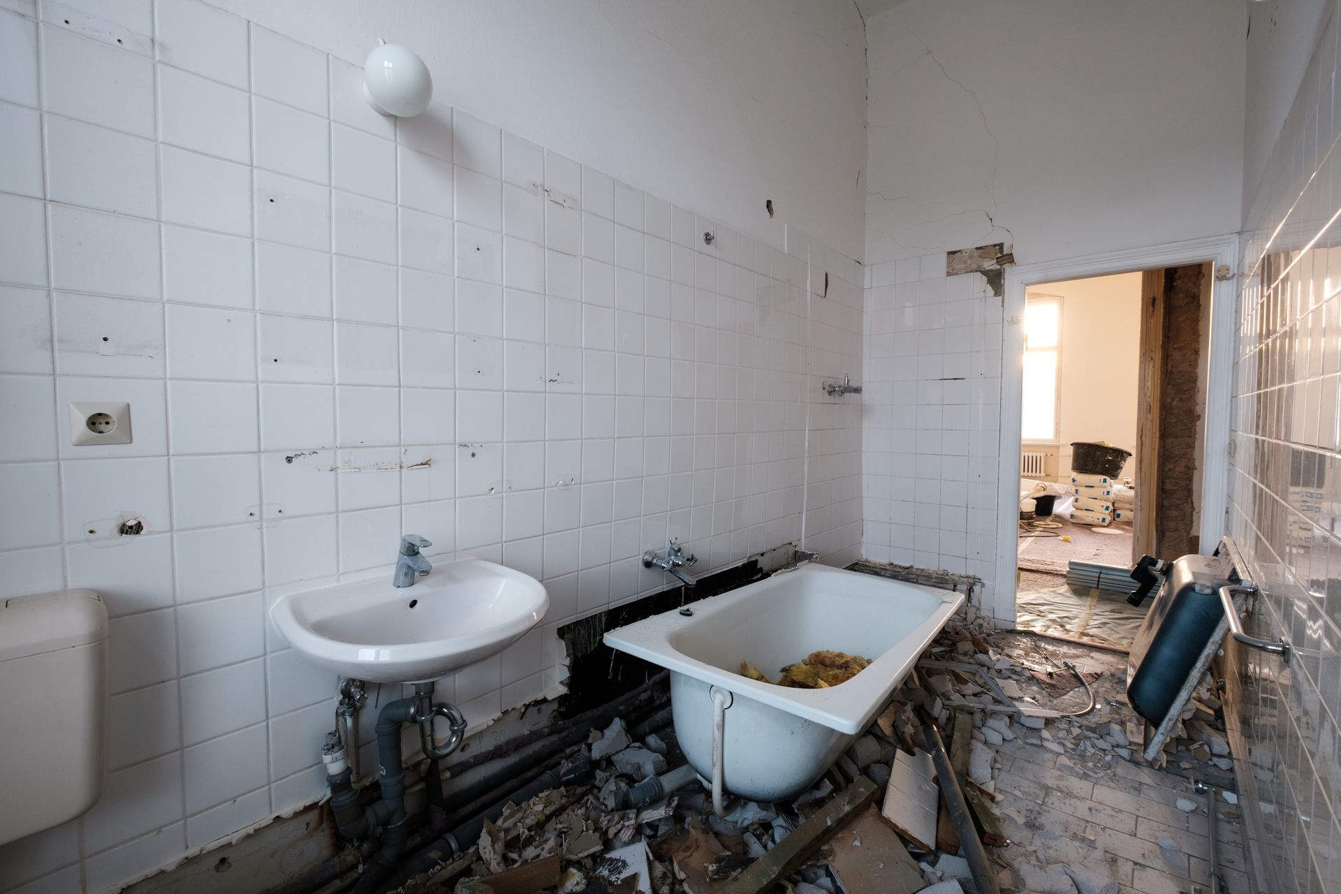 A bathroom with a sink and a bathtub in it.