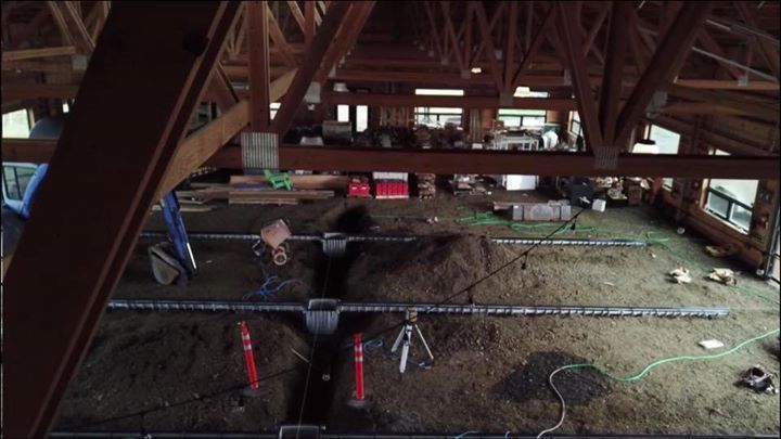 An aerial view of a building under construction with the number 8 on the floor